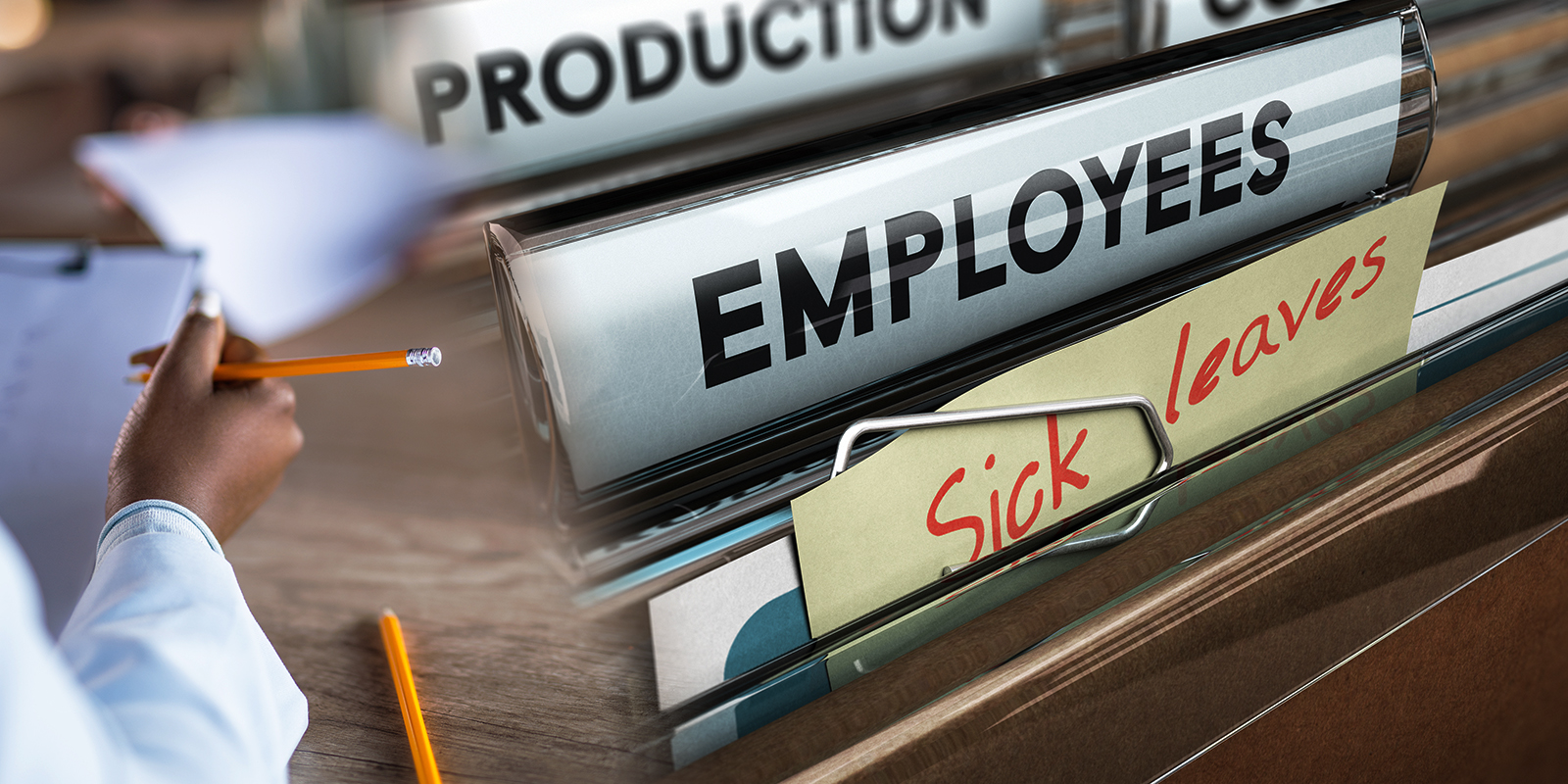 Close-up of a person writing with a pencil on the left, and file folders labeled 'Production,' 'Employees,' and 'Sick Leaves' on the right, symbolizing workplace management and employee records.